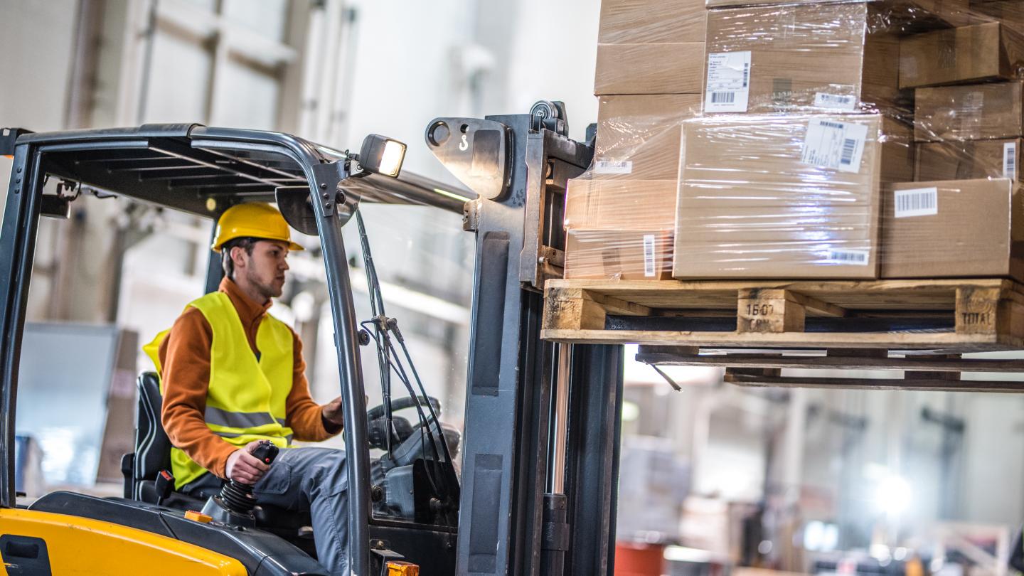 A person operating a forklift